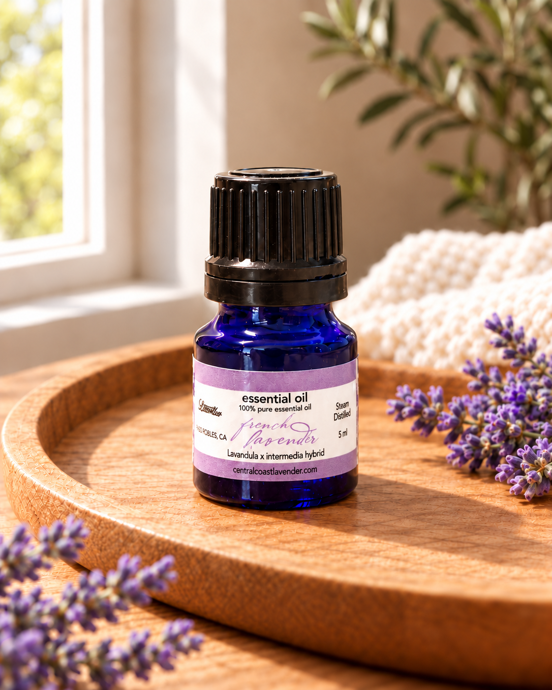 5 mL Lavandin Essential Oil bottle on a sunlit wooden tray with lavender